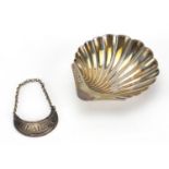 Silver and three footed shell shaped dish and Georgian claret decanter label, the dish 9.5cm in
