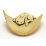 Japanese ivory Netsuke carved with a dog, 55cm wide : For Extra Condition Reports Please visit our