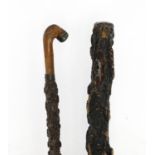 Two silver mounted cork walking sticks, the largest 91.5cm in length : For Extra Condition Reports