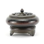 Chinese patinated bronze censer on stand, with prunus design lid, the censer with four figure