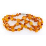 Amber coloured bead necklace, 60cm in length, approximate weight 33.4g : For Extra Condition Reports