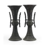 Pair of Japanese bronze vases with tin handles, cast with mythical animals, each 36.5cm high : For