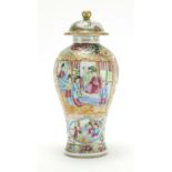 Chinese porcelain Canton baluster vase and cover, hand painted in the famille rose palette with