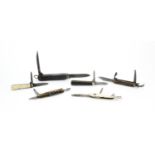 Six 19th century and later pocket multi tools including a German example with corkscrew and