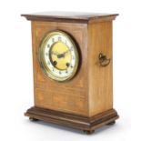 Inlaid mahogany mantel clock with twin handles, enamelled chapter ring and Arabic numerals, 27cm