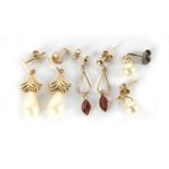 Three pairs of 9ct gold earrings, set with simulated pearls and garnets, the largest 2.5cm in