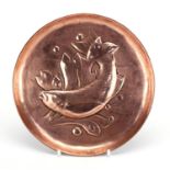Arts & Crafts circular copper dish embossed with a stylised fish by Newlyn, impressed Newlyn to