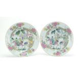 Pair of Chinese porcelain plates, each hand painted in the famille rose palette with figures and