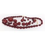 Cherry amber coloured bead necklace and loose graduated beads, approximate weight 93.0g : For