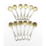 Set of twelve Russian silver ice cream spoons, the stems with stylised flowers, each with