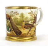 19th century porcelain tankard finely hand painted with wild birds before a landscape, 13.5cm high :