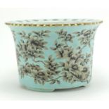 Chinese porcelain turquoise ground three footed planter hand panted with flowers, four figure iron