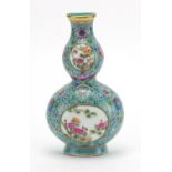Chinese porcelain double gourd vase wall pocket, finely hand painted in the famille rose with a