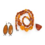 Butterscotch amber coloured bead necklace, silver mounted earrings and pendant, approximate weight
