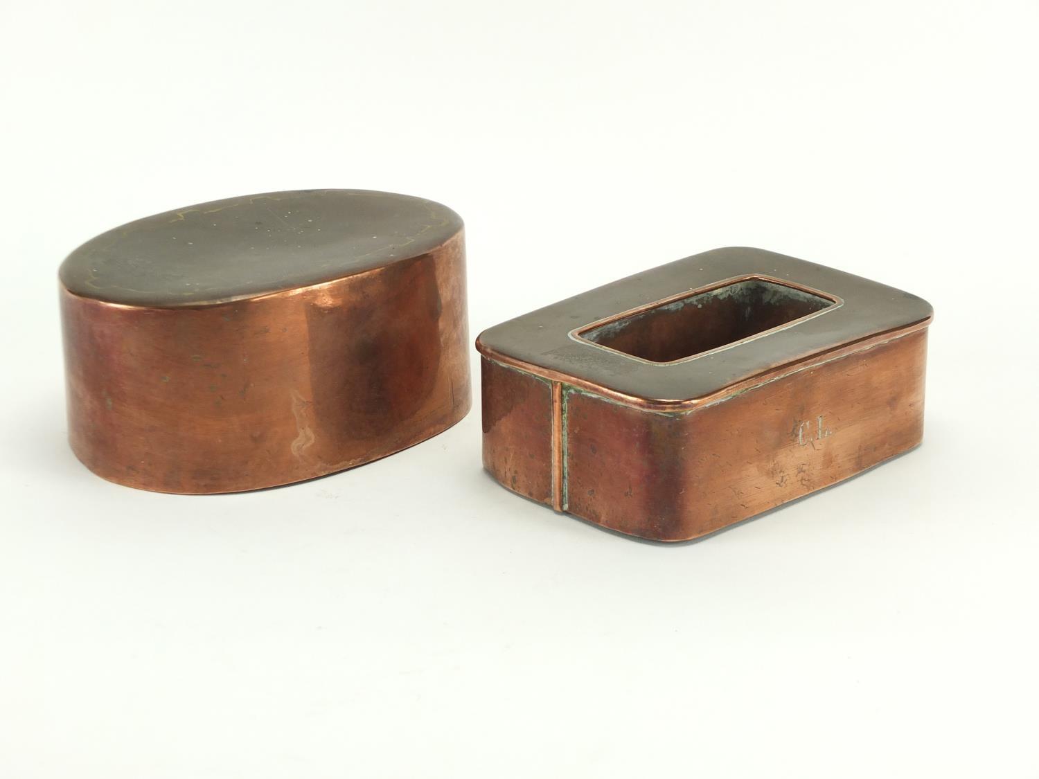 Two Victorian copper jelly moulds, the rectangular example numbered 3228, the largest 19.5cm