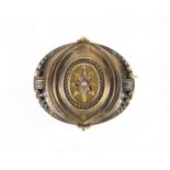 Victorian gilt metal mourning brooch set with a seed pearl, housed in a James Weir tooled leather