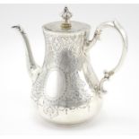 Victorian silver coffee pot, with engraved decoration, by Charles Boyton, London 1866, 22cm high,