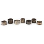 Seven silver napkin rings some with embossed and chased decoration, various hallmarks, approximate