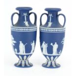 Pair 19th century Wedgwood Jasper Ware vases with twin handles, each decorated in low relief with