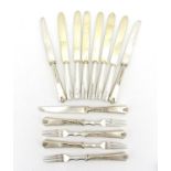 Thirteen Russian silver knives and forks some with stylised flower handles, each with impressed 84