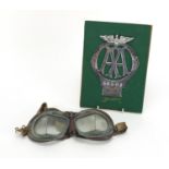 AA Telegram Fanum car radiator badge and a pair of driving goggles, the badge numbered 46501, 14cm