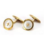 Pair of continental gold and Mother of Pearl cuff links, indistinct marks, 1.5cm in diameter,