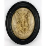 Ivory style relief panel depicting a Biblical scene, housed in a convex ebonised frame, overall 39cm