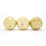 Three 19th century turned ivory billiard balls, each approximately 5.3cm in diameter : For Extra