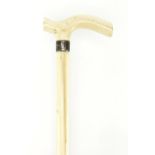 Carved ivory walking stick with unmarked silver collar, 91cm in length : For Extra Condition Reports