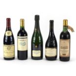 Four bottles of alcohol including a bottle of La Grande Année Bollinger 1999 and Chateau Foureau