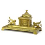 19th century gilt brass desk inkwell mounted with griffinns, cast with stylised foliate motifs, 22cm