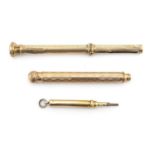 Three propelling pencils including two unmarked gold examples, one being by S Mordan & Co, the