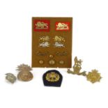 British Militaria including Royal Marine helmet plate, The Kings own badges and pips