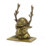 Novelty Victorian brass deer design inkwell wearing a jockeys cap, 11cm high