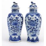 Pair of Chinese blue and white porcelain baluster vases with covers, hand painted with flowers, four