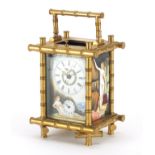 Aesthetic style gilt brass carriage alarm clock, with subsidiary dial and enamelled panels, housed