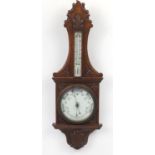 Oak aneroid barometer carved with a shield, 90cm high : For Further Condition Reports Please Visit