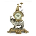 Bronzed elephant design Imperial mantel clock striking on a bell, the drum clock having an enamelled