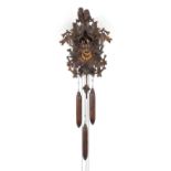 German Black Forest cuckoo clock with Roman numerals by Regula, carved with birds, foliage and