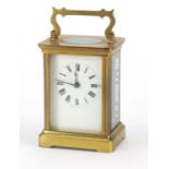 Brass cased carriage clock with enamelled dial and Roman numerals, 11cm high : For Further Condition