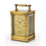 Brass cased carriage clock retailed by Dent of London, the back plate impressed KJB, 9.5cm high :