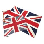 Three British Ensign flags, including one with pole, two stamped British made, the largest 165cm x