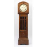 Edwardian oak eight day chiming long case clock, with subsidiary dial, the silvered face having