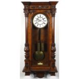 Walnut Vienna regulator wall clock with enamelled dial, carved with Corinthian columns, 105cm in