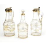 Pair of early 19th century French cut glass claret jugs with silver gilt lids and a similar