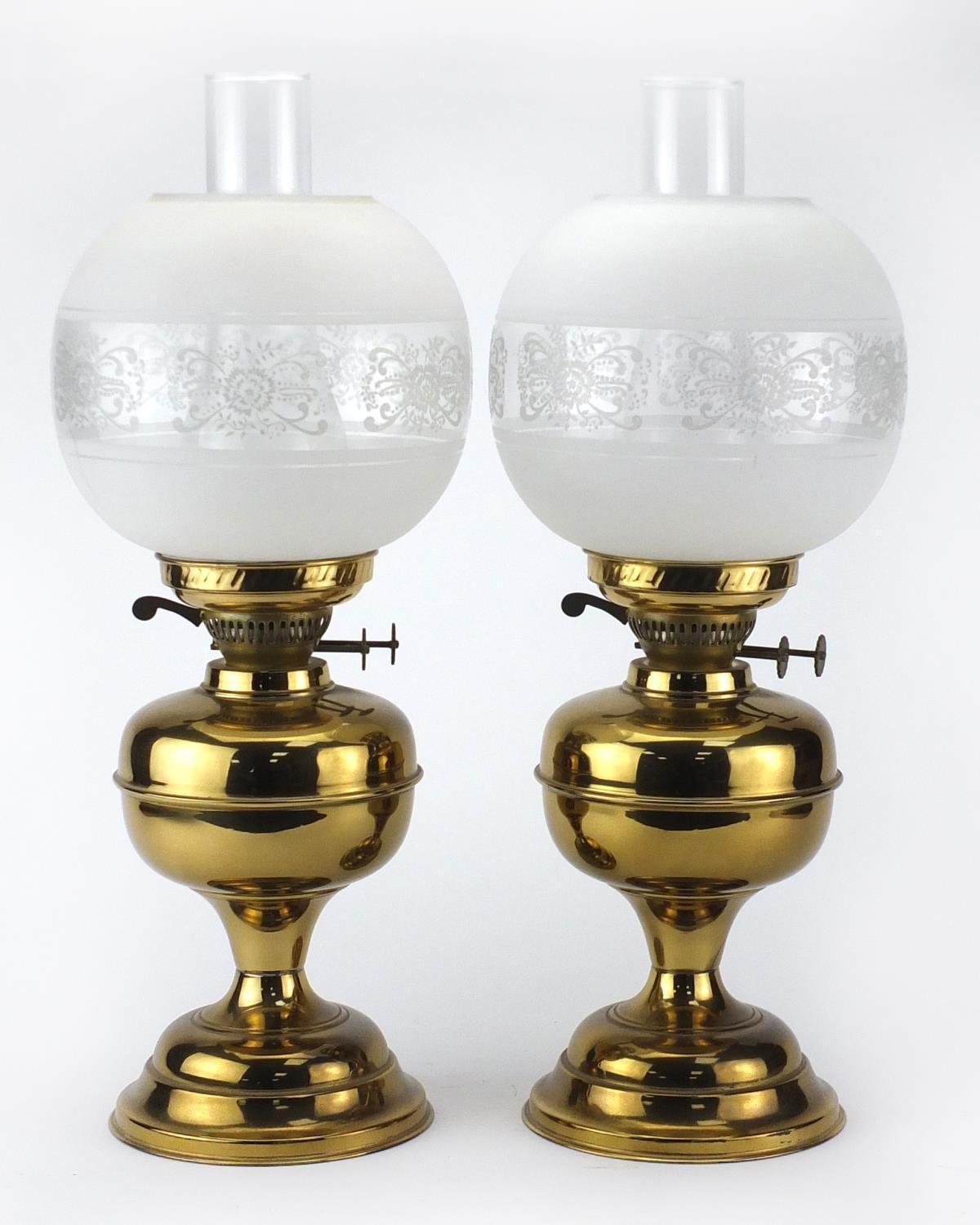Pair of brass oil lamps with glass funnels and etched globular shades, each 51cm high : For - Image 2 of 3