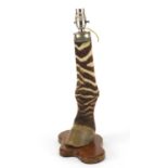 Vintage zebra's leg and hoof table lamp on a shaped mahogany base, 40.5cm high : For Further