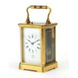 Brass cased repeating carriage clock striking on a gong retailed by Dent of London, the enamelled