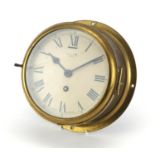 Smiths brass eight day ships bulk head design clock, by Smiths with Roman numerals, 22.5cm in