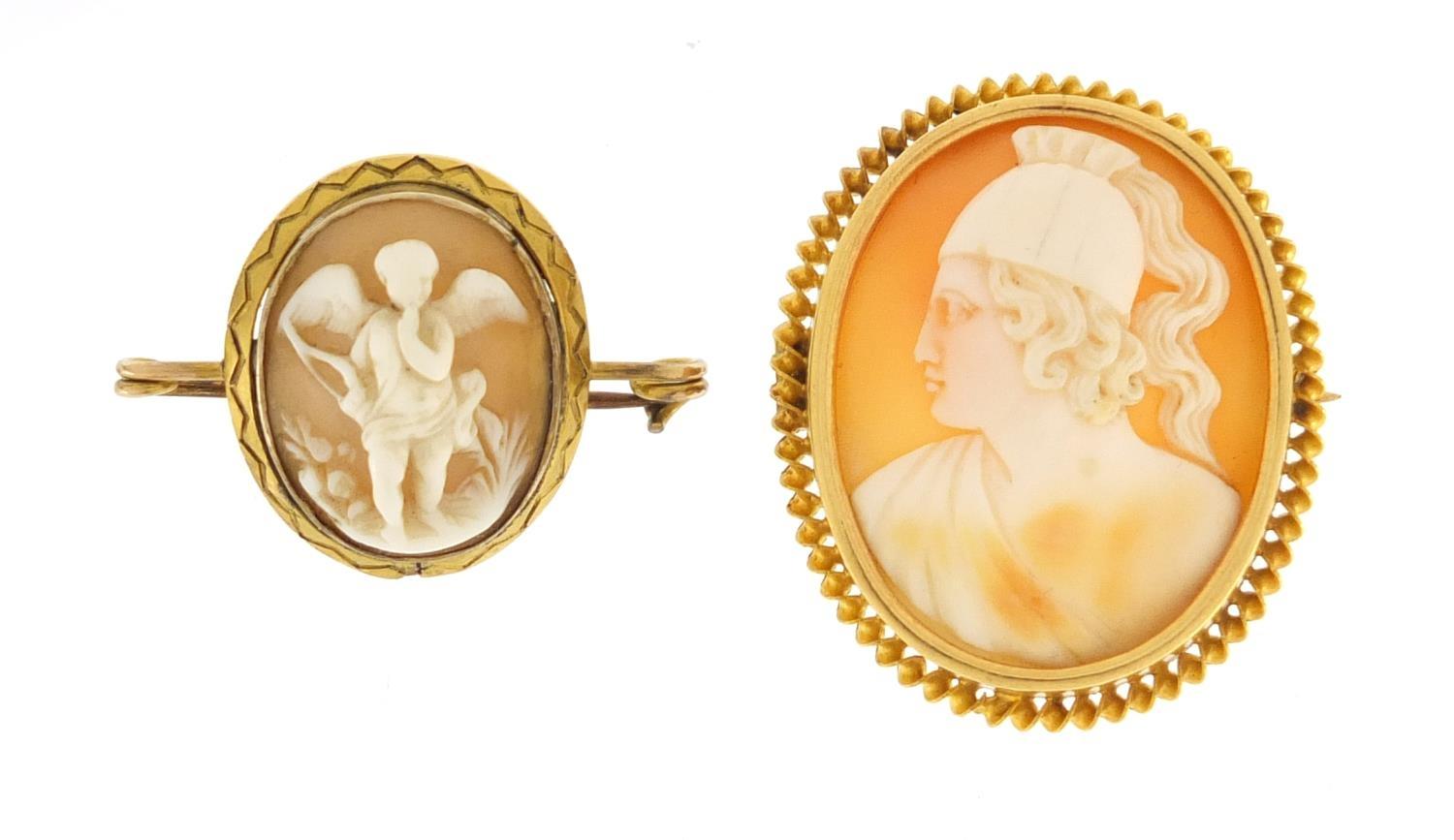 Two cameo brooches with gold mounts including cupid, the largest 3.5cm in length, approximate weight